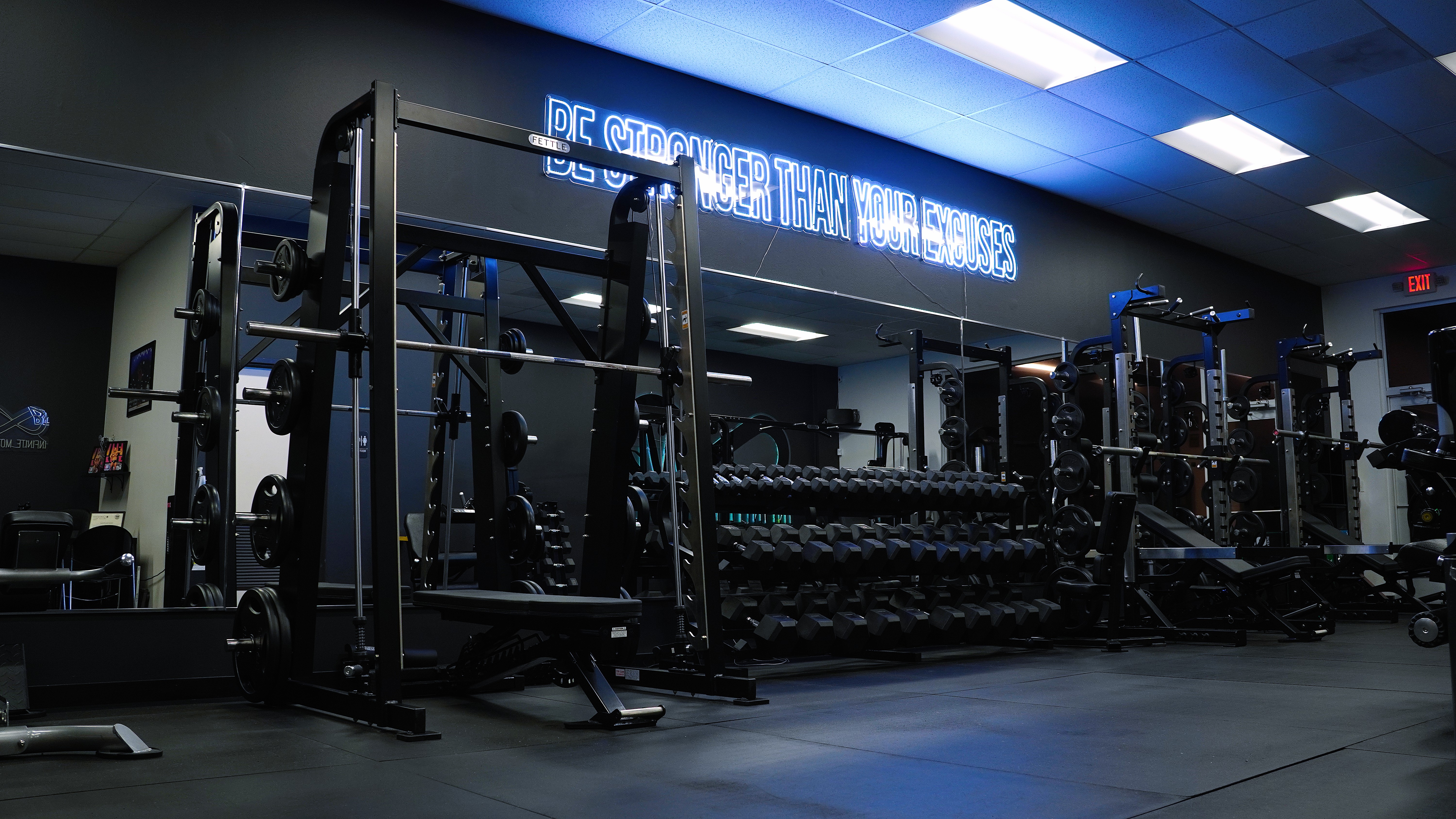 Wide angle view of the gym showing various training areas and equipment