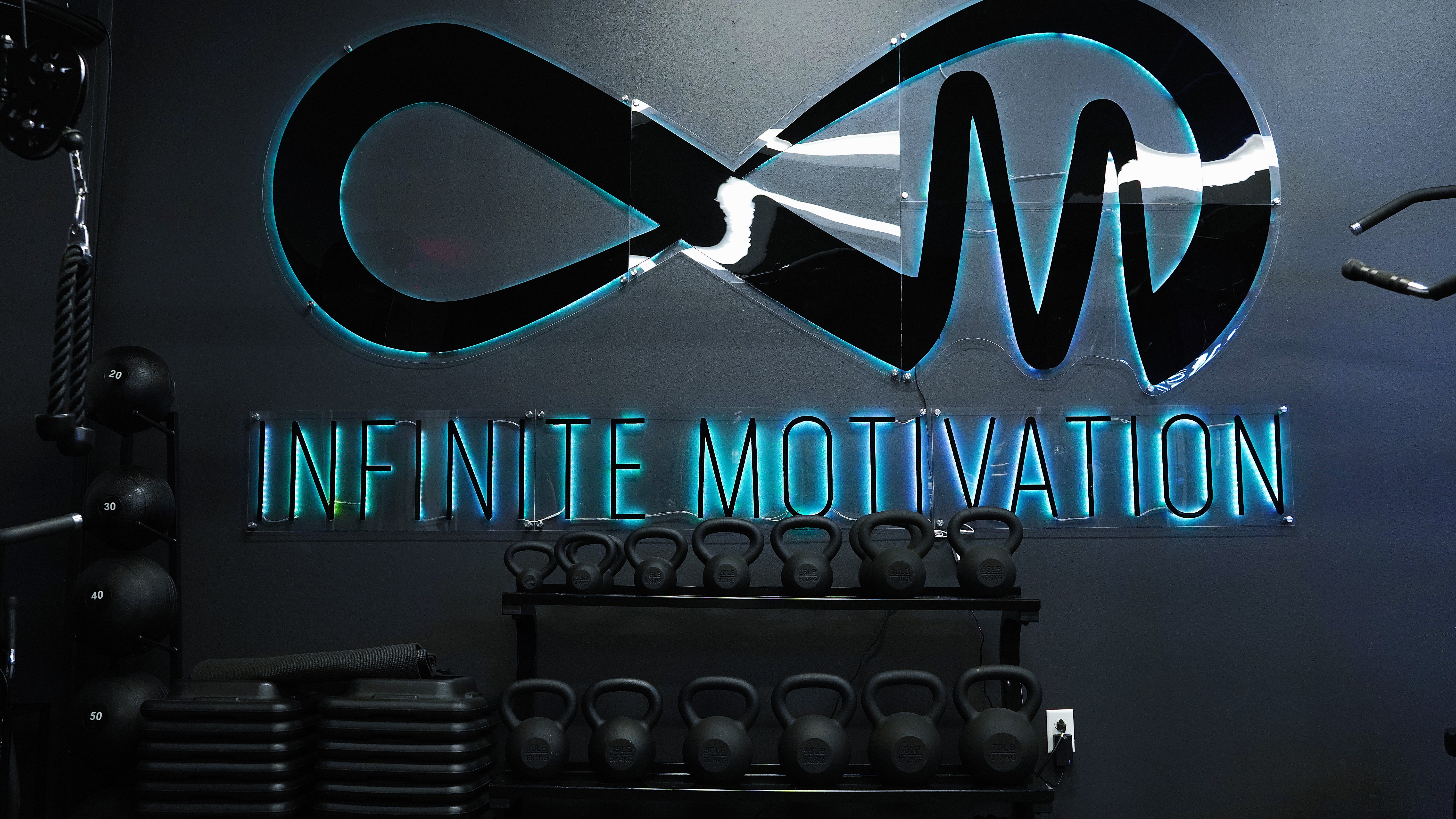Infinite Motivation sign inside the studio